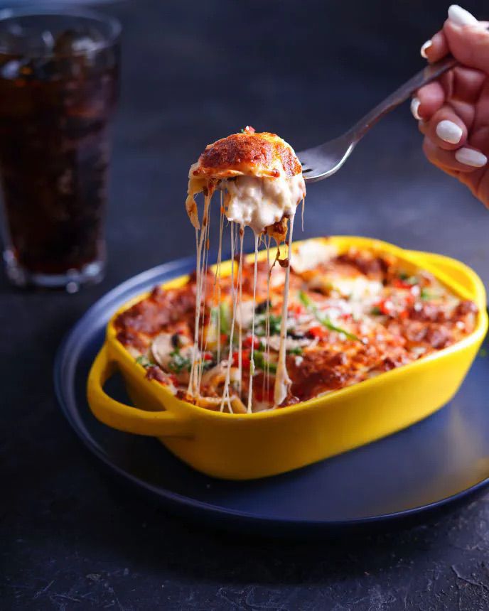 Vegan lasagna in a yellow baking dish