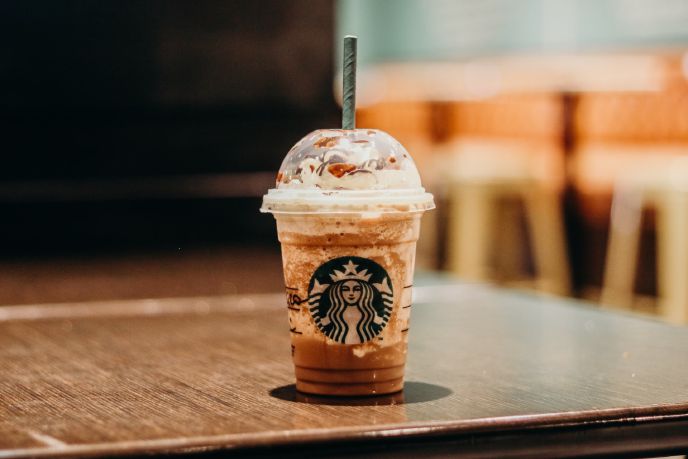 Starbucks Drink with whipped cream on a table