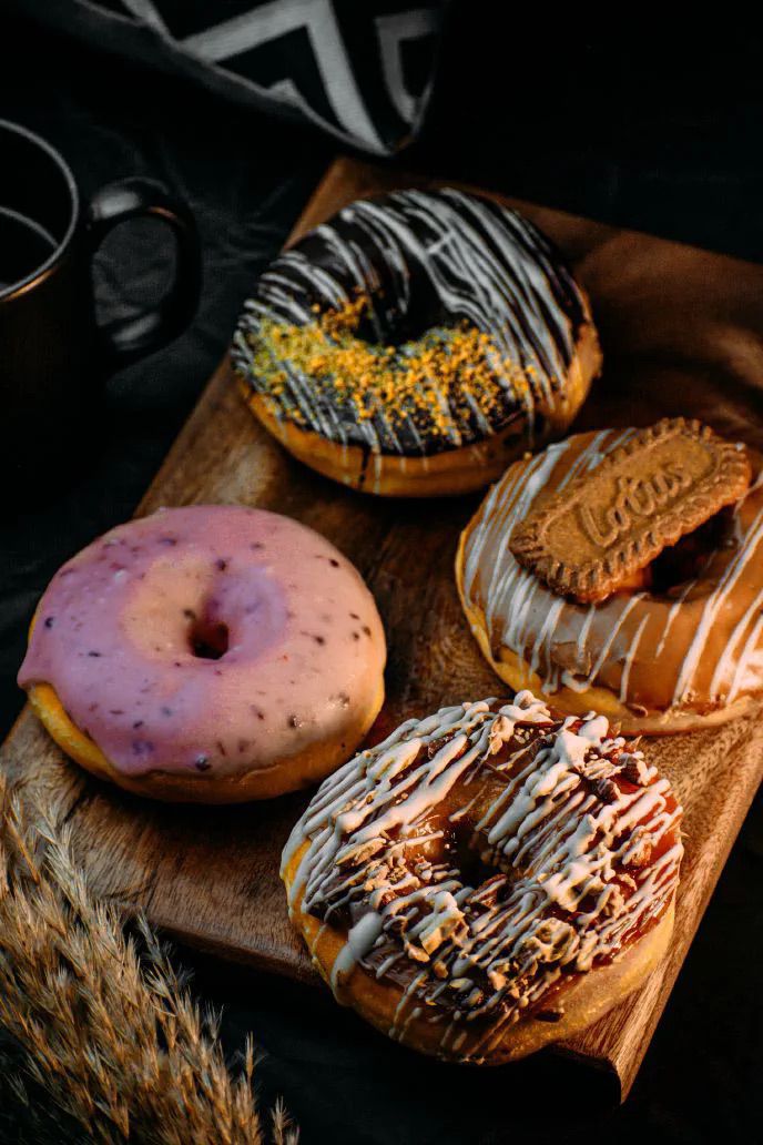 Assorted cake mix donuts on a cutting board